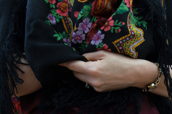 Elena's scarf is a traditional l Pavlovo Posad worn by Russian babnuskhas.