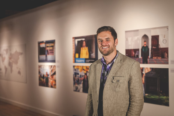 The photographer poses at the Cosmopolis launch. 