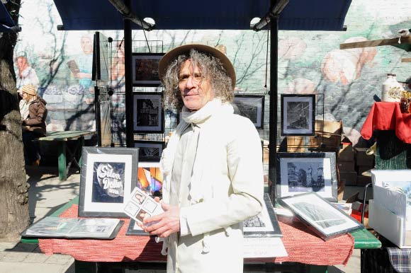 Stephen Zaitsov, selling his Toronto images at the market.