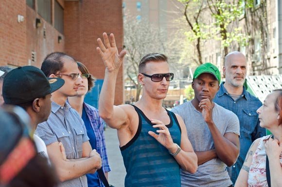 Jane's Walk participants share their stories of a sex-positive Village, in the alley outside of Steamworks.