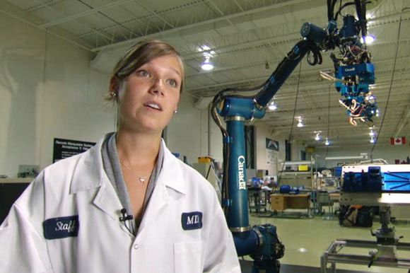 Panek with the Next Generation Canadarm in a shoot for Discovery Channel's, Daily Planet.