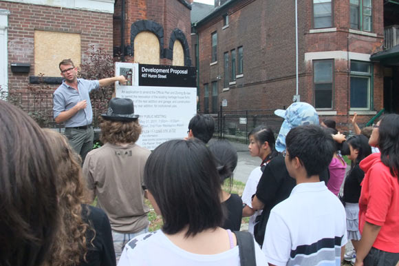 Planner Jed Kilbourn walks students through a nearby development application.