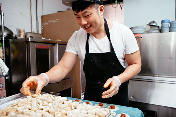 Mark Lee crafting kimchi potstickers at Patois.