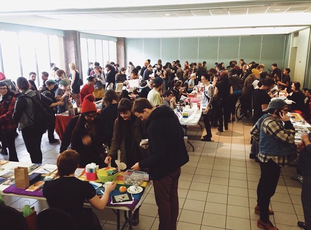 Zine makers and buyers browse the tables at last year's Toronto Queer Zine Fair.