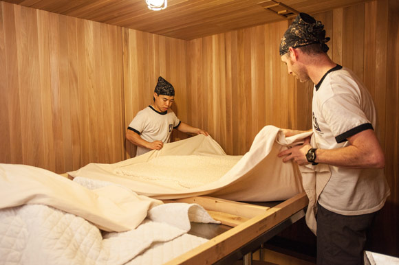 Senior Brewer Kosuke Shimamura and Head Brewer Greg Newton preparing Koji for sake distillation process.