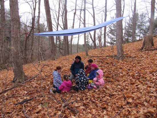 A group of young students learn about the land at the Kortright Centre. 